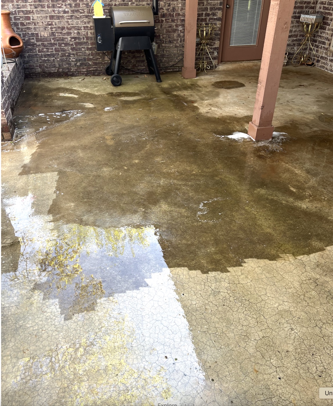 Dirty stained patio before pressure washing in Norman, OK